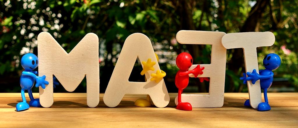 Team collaborating in modern office with digital devices